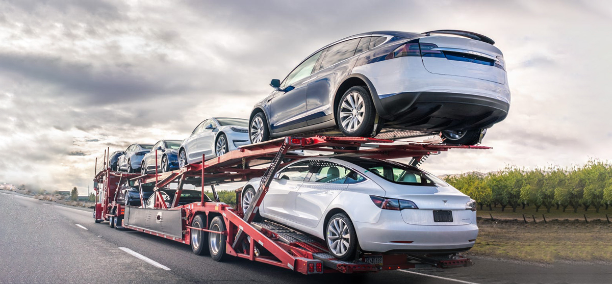 an open trailer with loaded cars